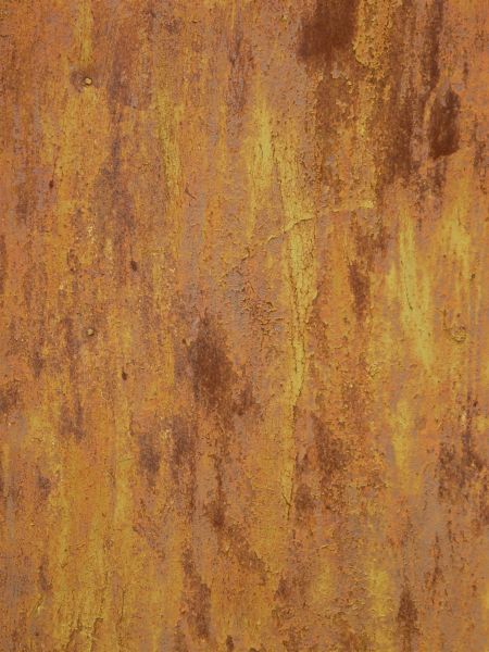 Yellow metal texture, covered with streaks and patches of rust in various shades of pink, red and grey.